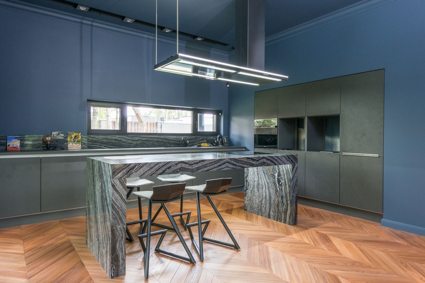 Modular kitchen with bookmatched stone island by Varun Marbles